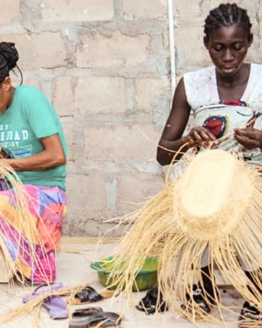 Artisans weaving straw hats