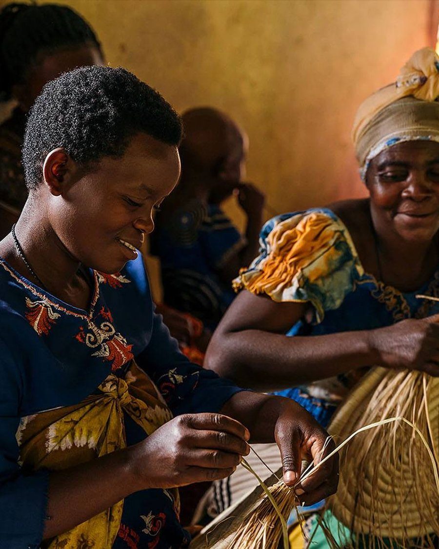 Women weaving baskets by hand